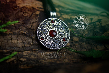 Eagle Head Triskele Pendant in Sterling Silver with Red Garnet Stones